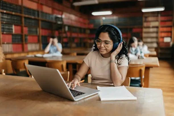 Student with headphones preparing for IELTS